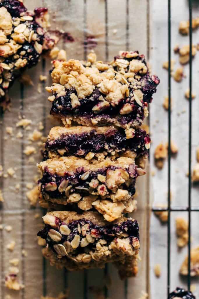 sliced blueberry crumble bars stacked on their side