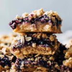 a stack of sliced blueberry crumble bars