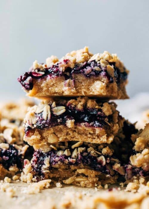 a stack of sliced blueberry crumble bars