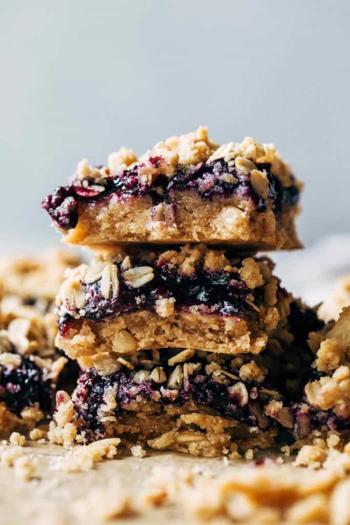 a stack of sliced blueberry crumble bars