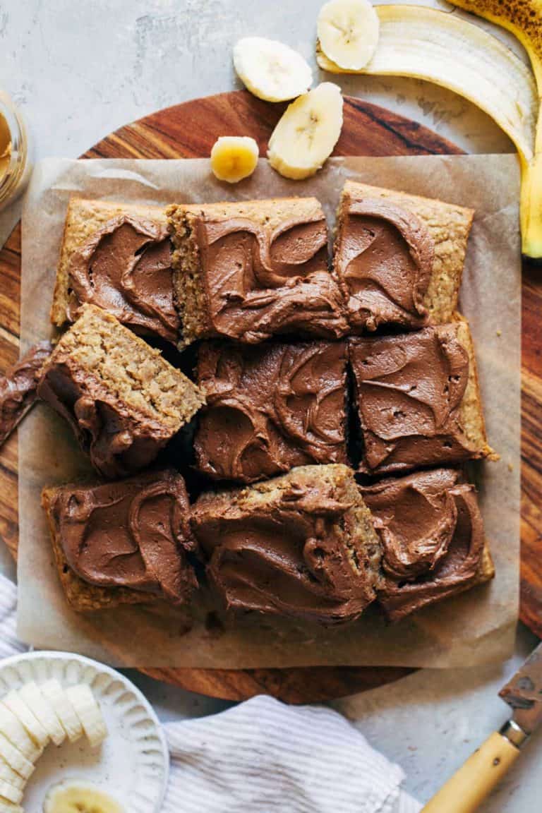 sliced banana sheet cake on a round cutting board