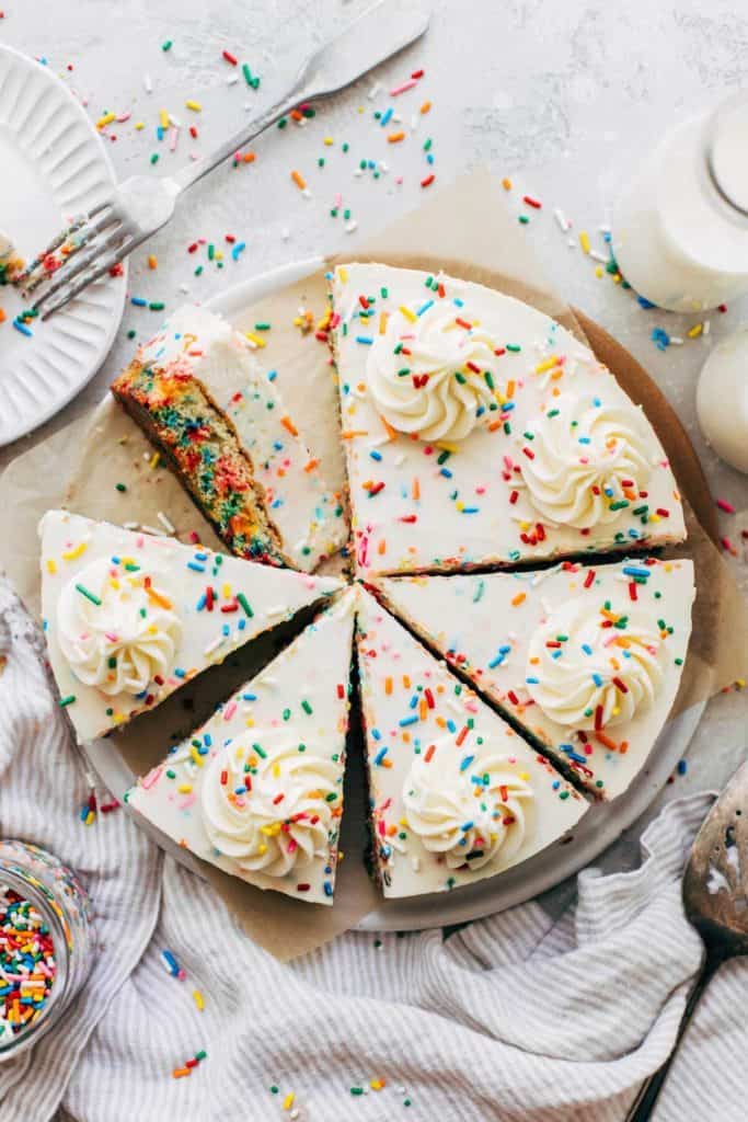 top view of a sliced birthday cake cheesecake