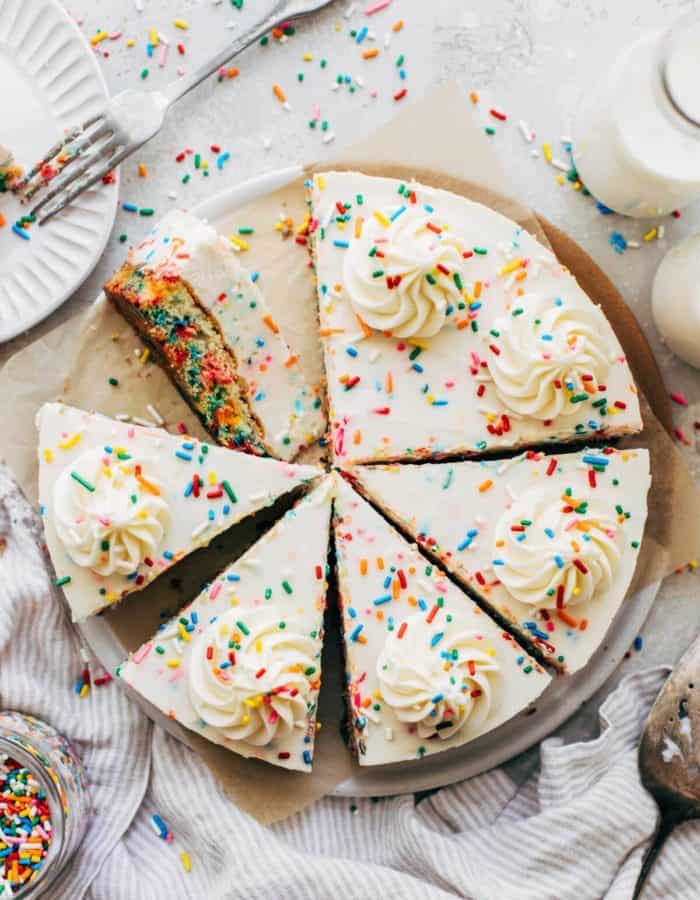top view of a sliced birthday cake cheesecake
