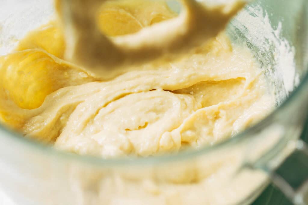 process shot of lemon cake batter in mixing bowl