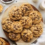 a round serving platter full of oatmeal chocolate chip cookies