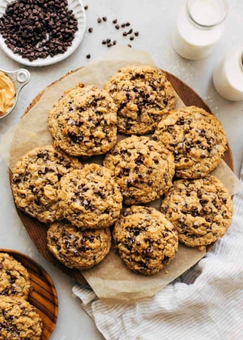 a round serving platter full of oatmeal chocolate chip cookies