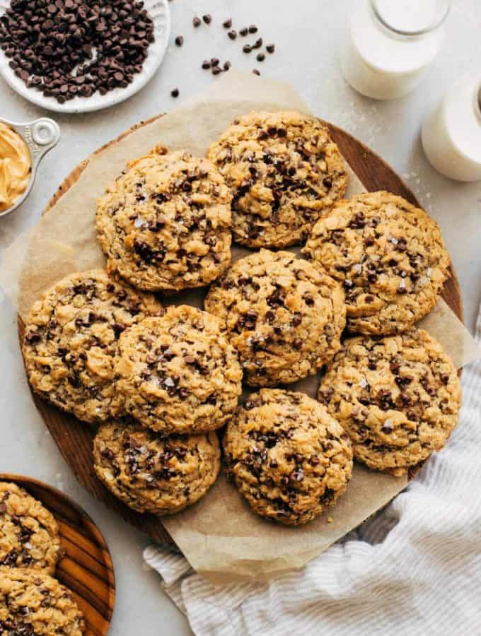a round serving platter full of oatmeal chocolate chip cookies
