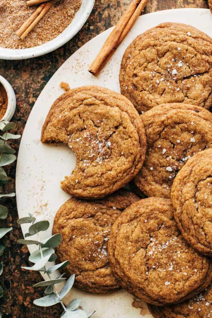 pumpkin cookies arranged on a round white serving tray