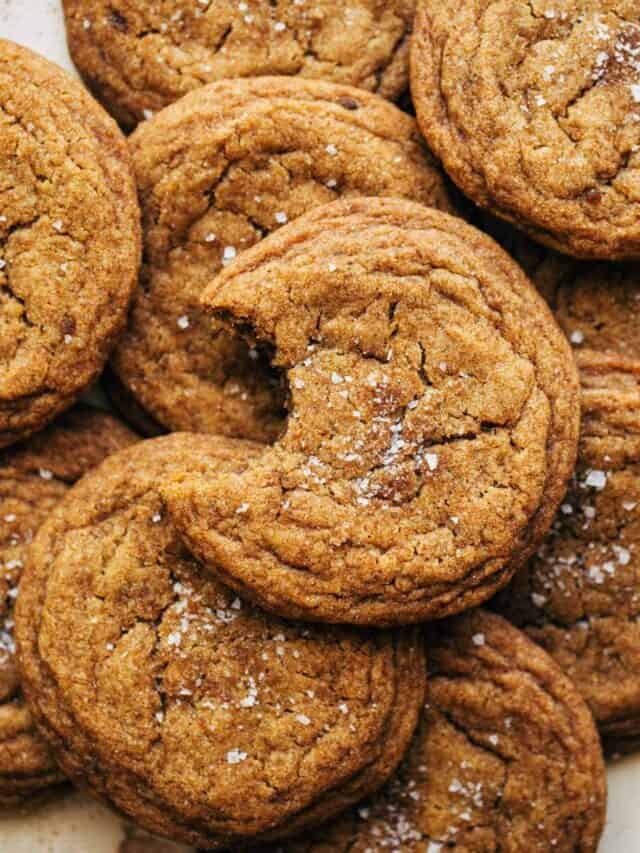 close up on a pumpkin cookie with a bite taken out