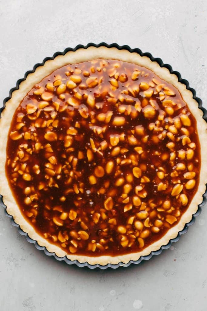 peanut caramel poured into a shortbread pie shell