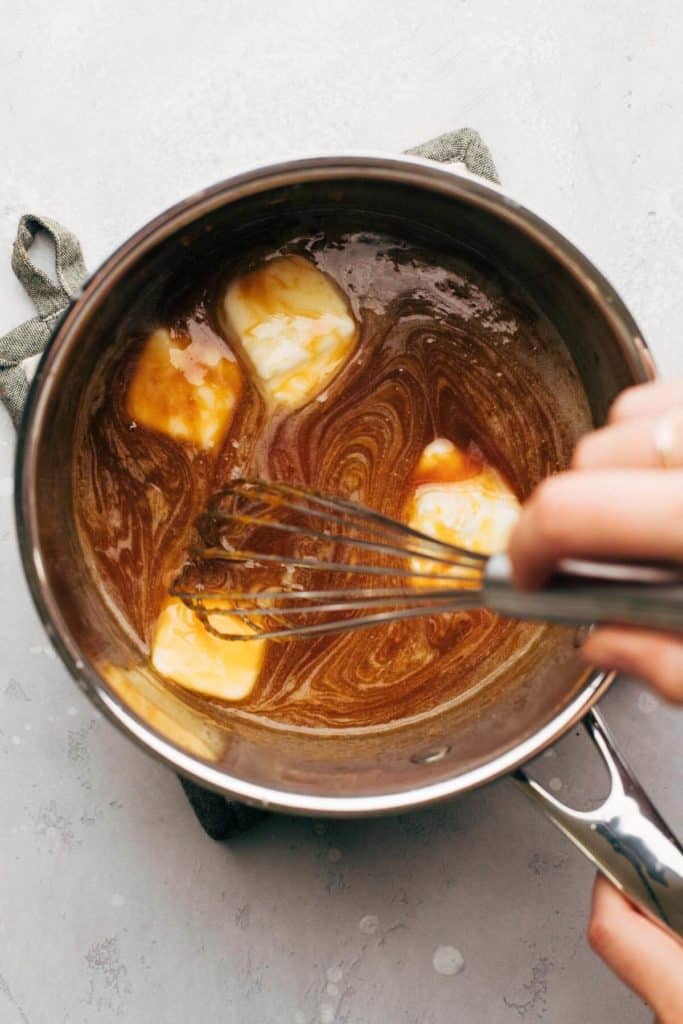 whisking butter into melted sugar