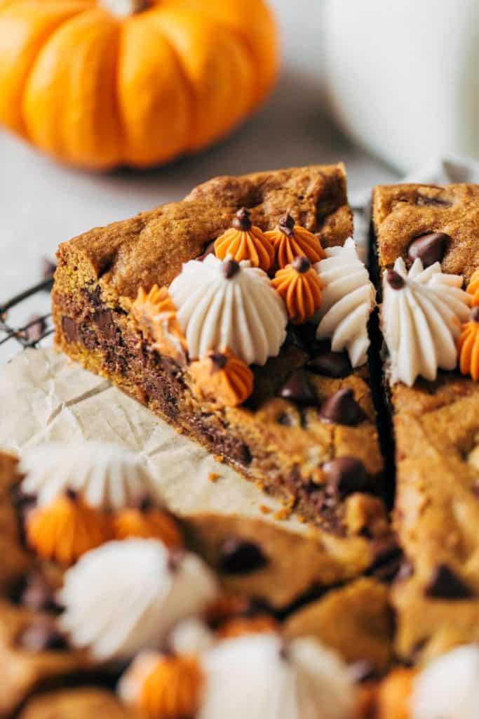 close up on a slice of pumpkin chocolate chip cookie cake