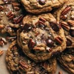 close up on the top of a butter pecan cookie with melty chocolate chips