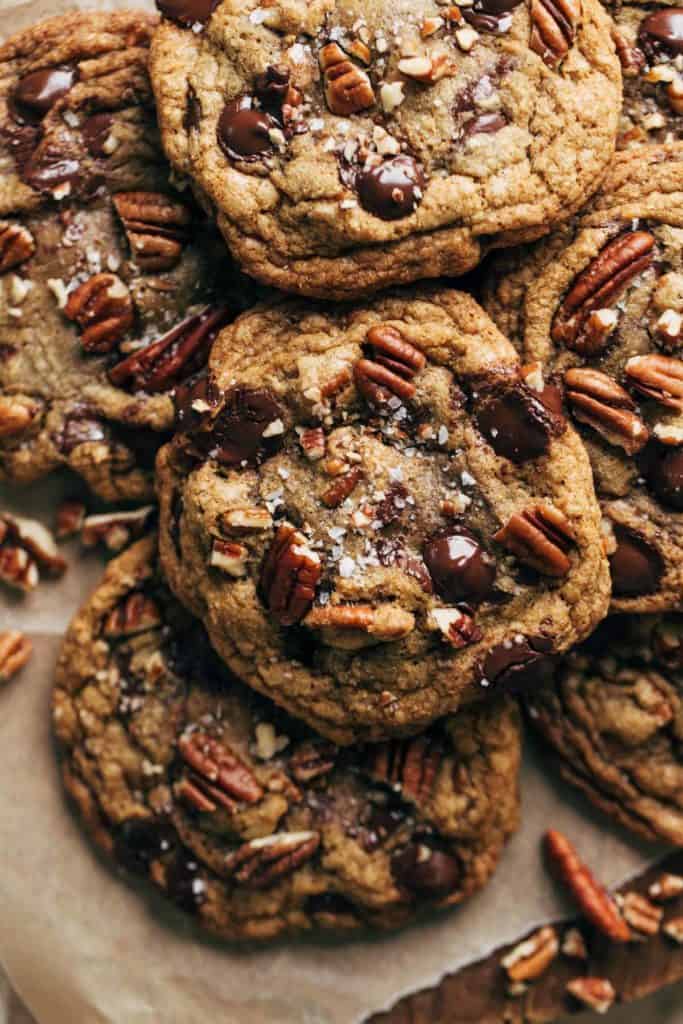 close up on the top of a butter pecan cookie with melty chocolate chips