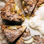 close up on the top of a sliced apple cake