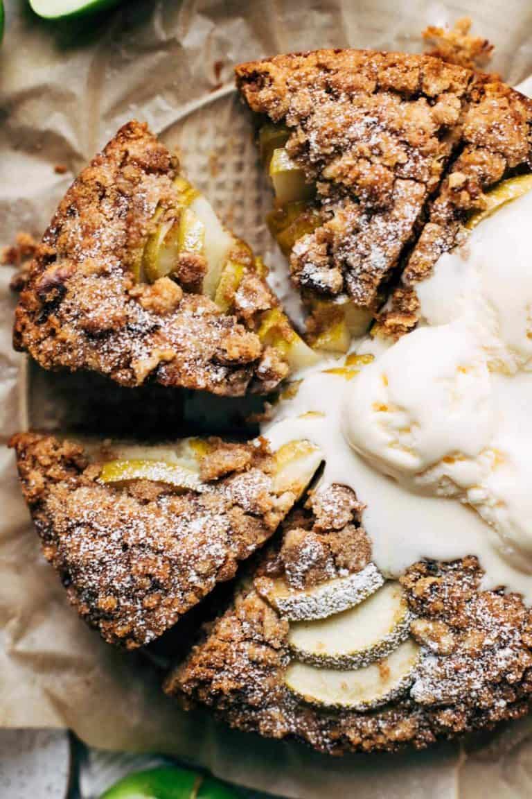 close up on the top of a sliced apple cake