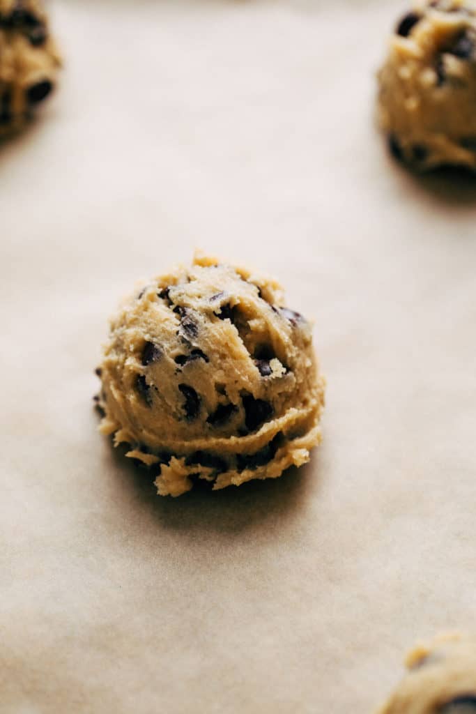 scooped cookie dough on a baking sheet