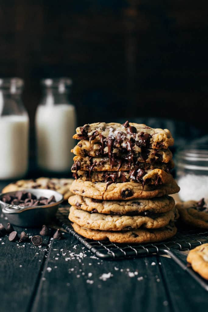 a stack of chocolate chip cookies with melting chocolate chips