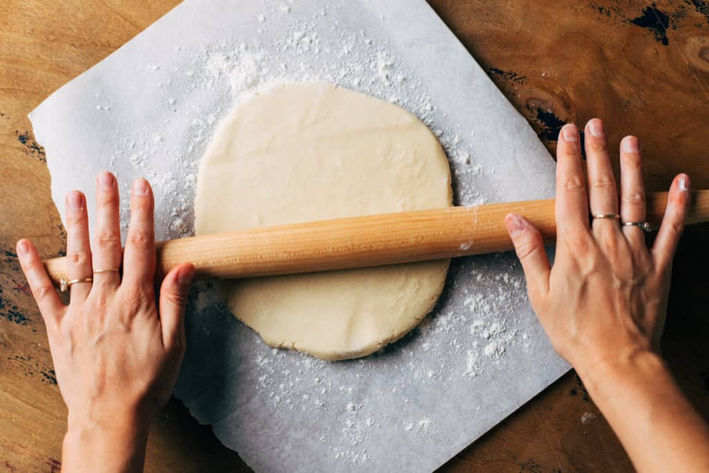 rolling out sugar cookie dough