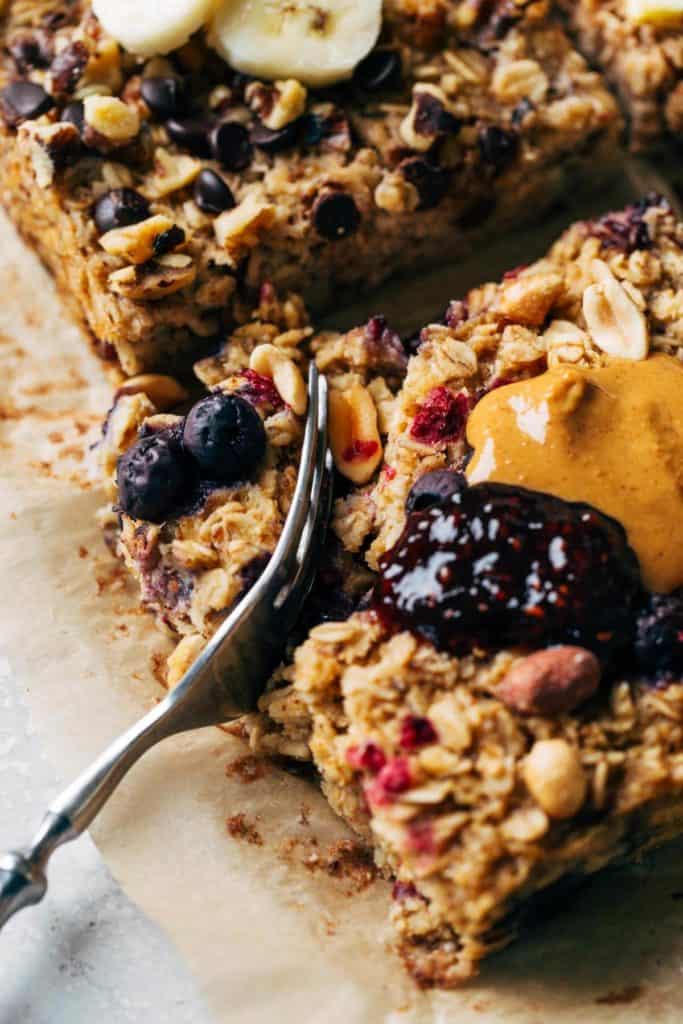 digging a fork into a slice of baked oatmeal