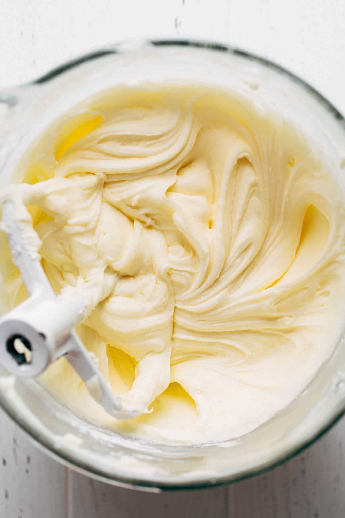 a mixing bowl of cream cheese frosting