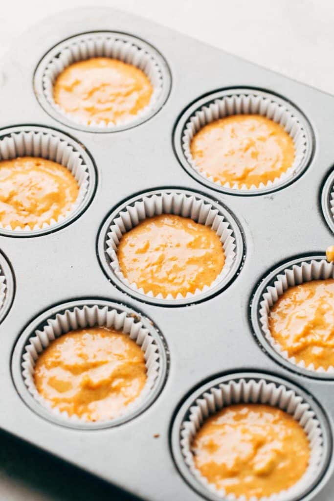 cupcake liners filled with carrot cake batter