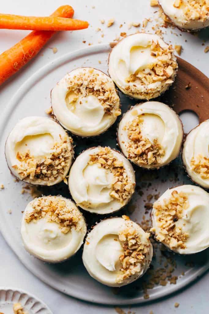 the top of carrot cupcakes topped with cream cheese frosting