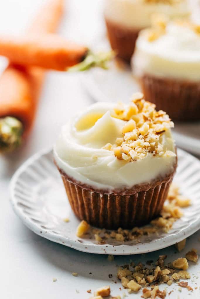 a carrot cupcake on a small dessert plate