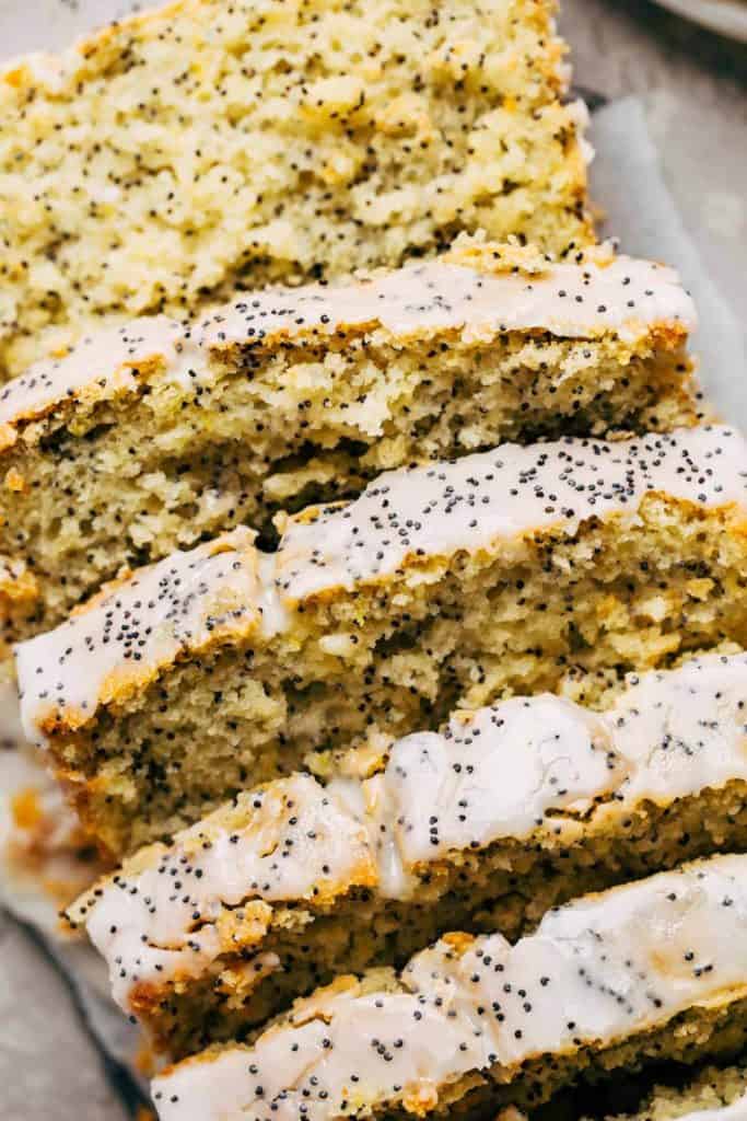 close up on a sliced loaf of lemon poppy seed bread