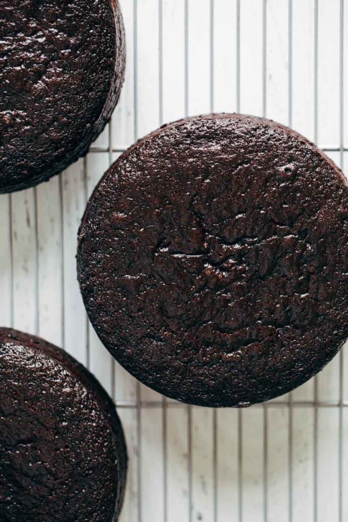 baked layers of chocolate cake on a cooling rack