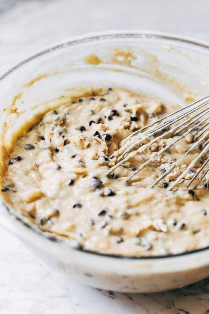 process shot of chocolate chip banana bread batter in mixing bowl