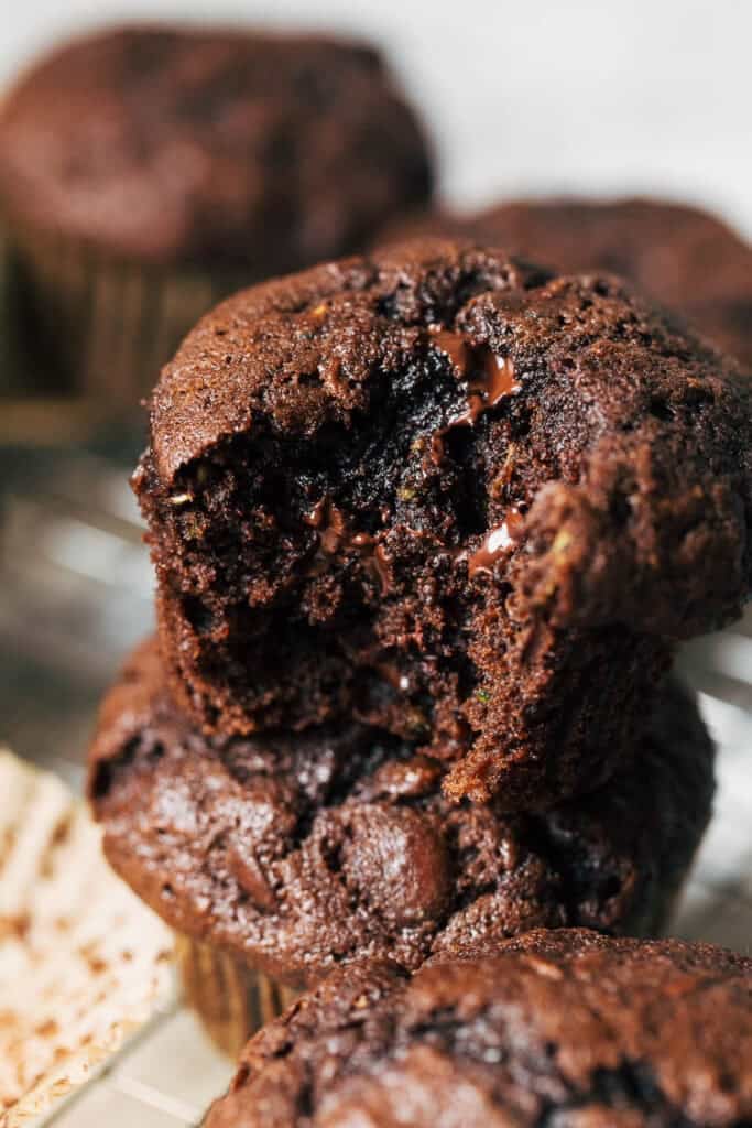 a stack of chocolate zucchini muffins