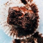 close up on a bite taken from a moist chocolate muffin