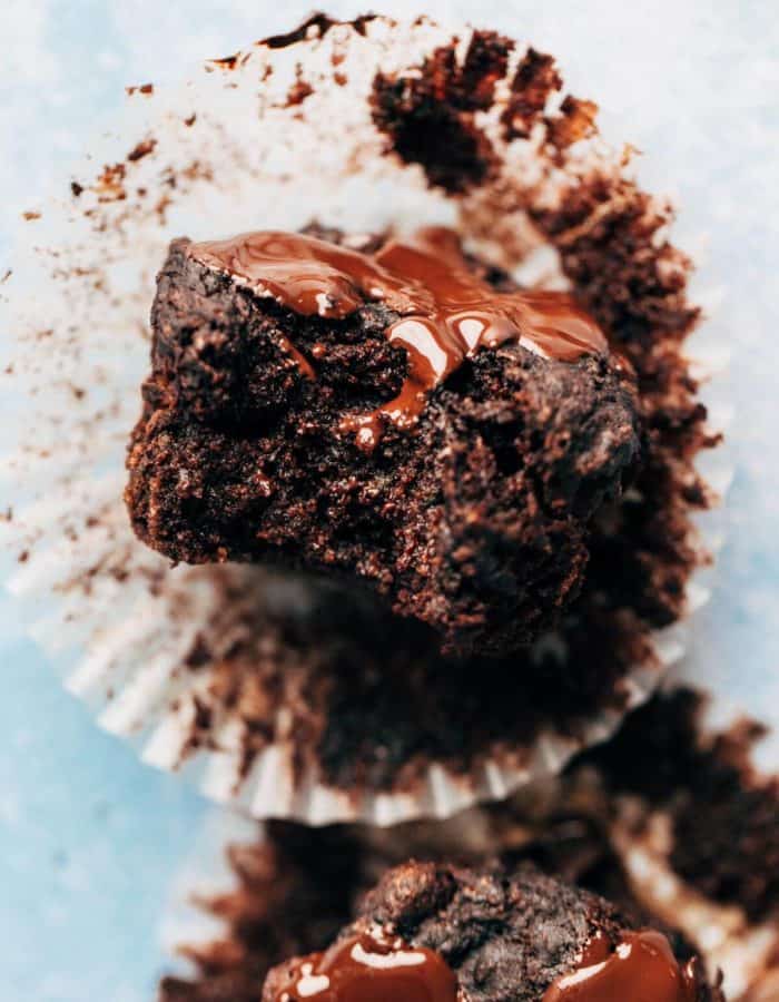 close up on a bite taken from a moist chocolate muffin