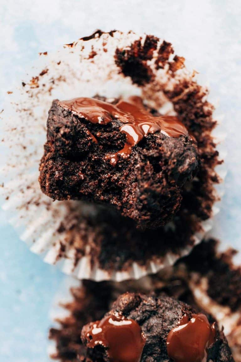 close up on a bite taken from a moist chocolate muffin