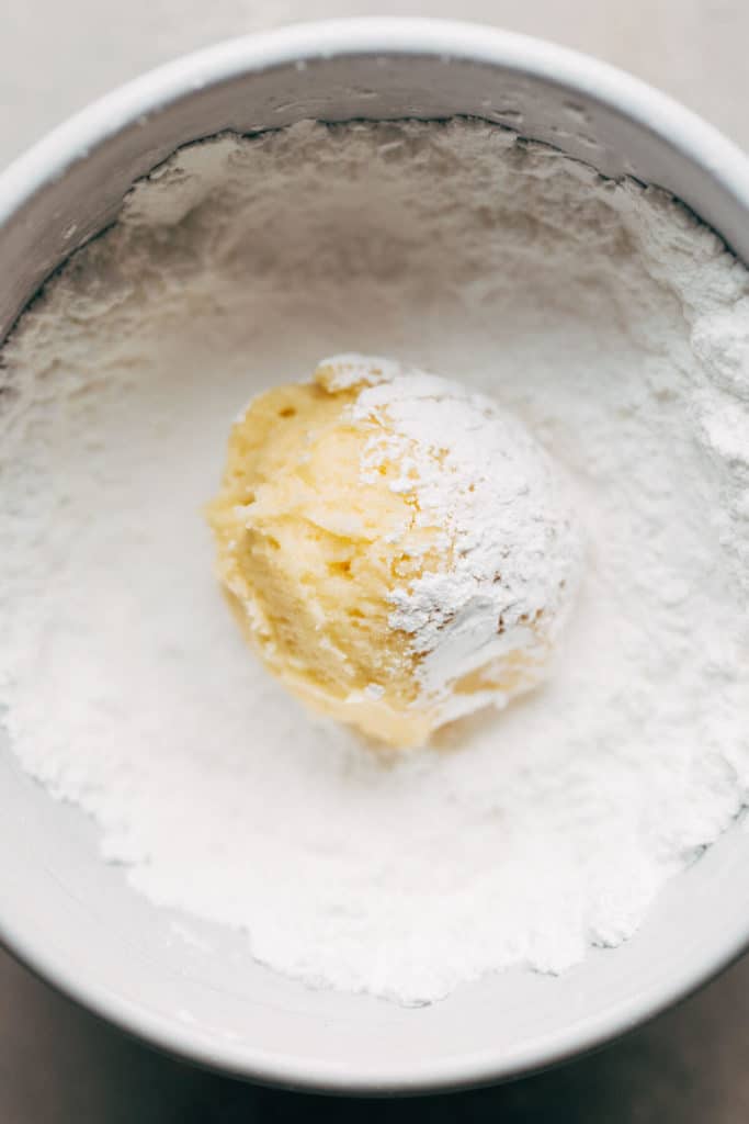 gooey butter cookie dough ball rolled in powdered sugar