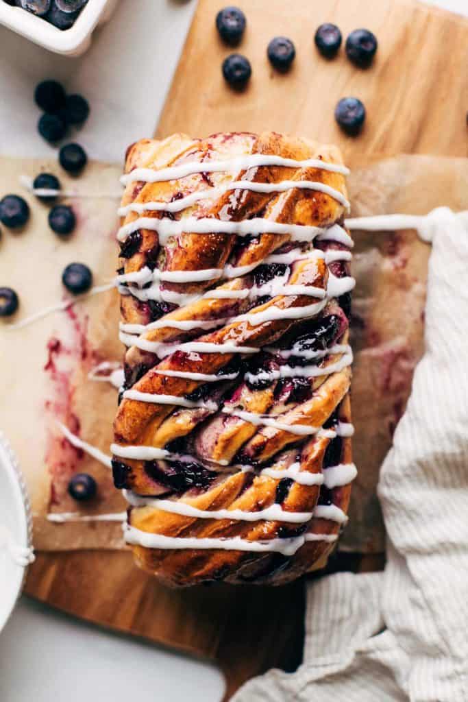 the top of a blueberry babka loaf drizzled in icing