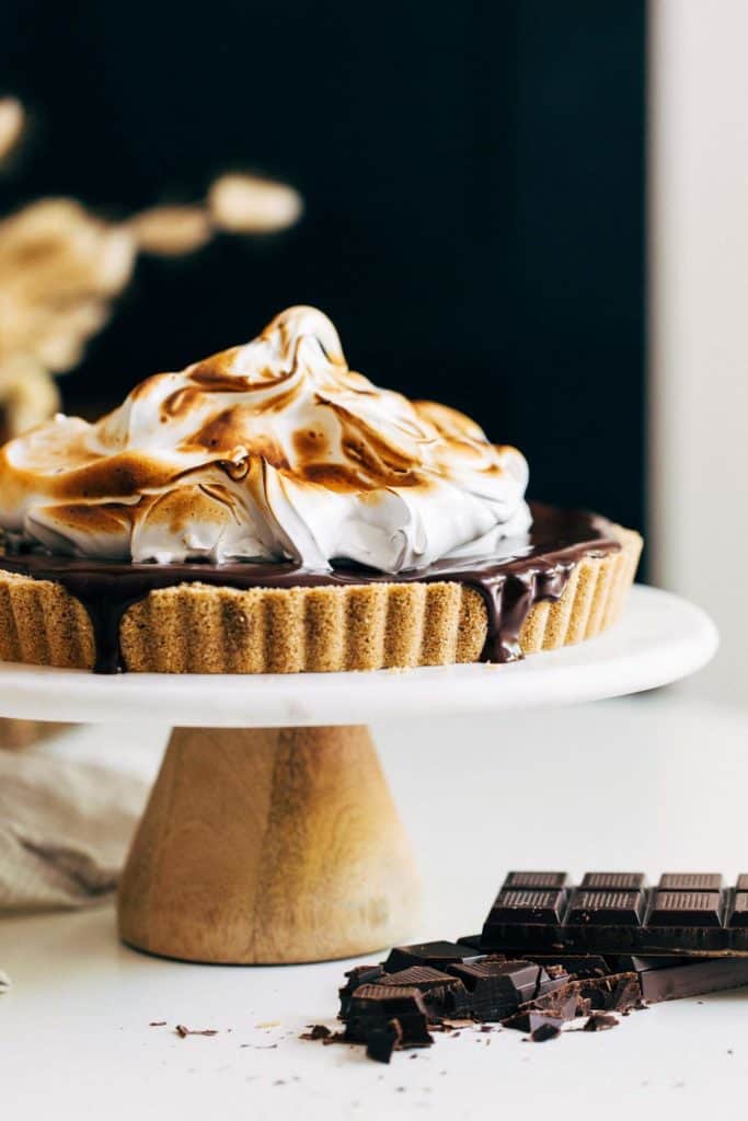 no bake smores cheesecake topped with toasted marshmallow meringue