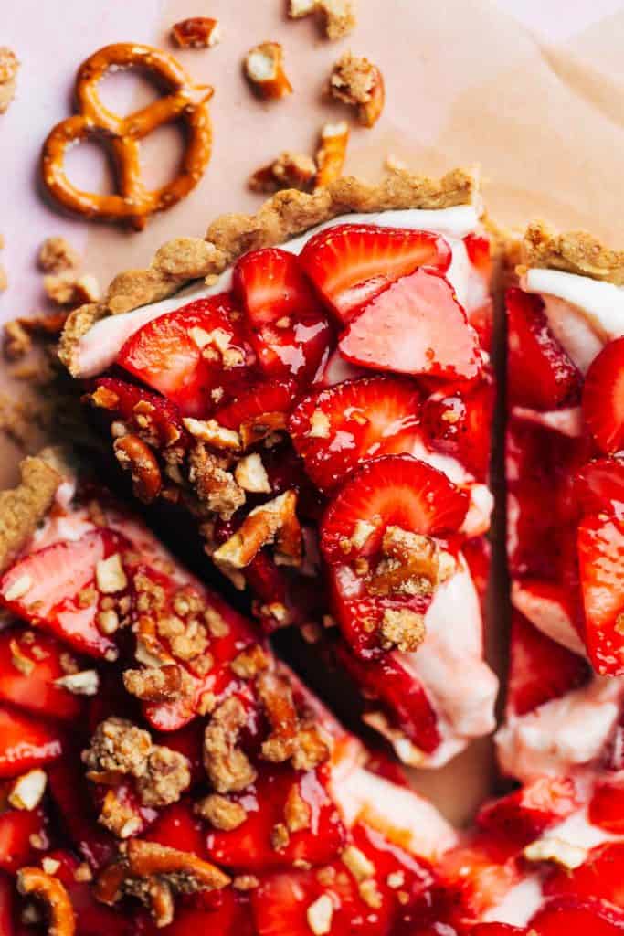 the top of a strawberry pretzel tart slice