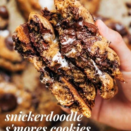 holding a stack of smores cookies split in half