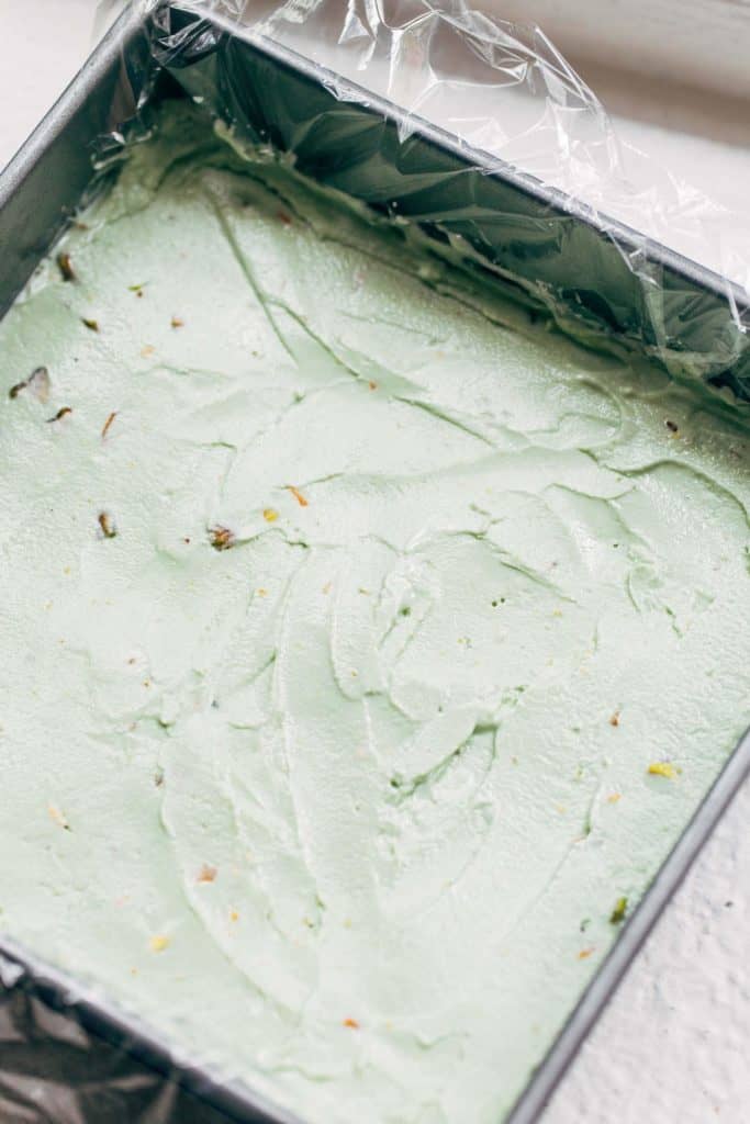 pistachio ice cream spread in a baking pan