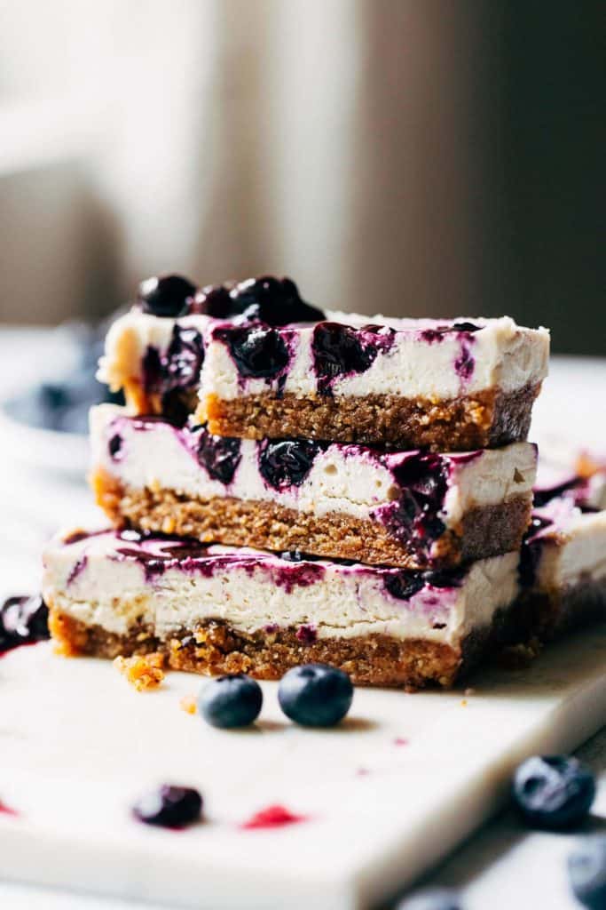 a stack of blueberry cheesecake bars