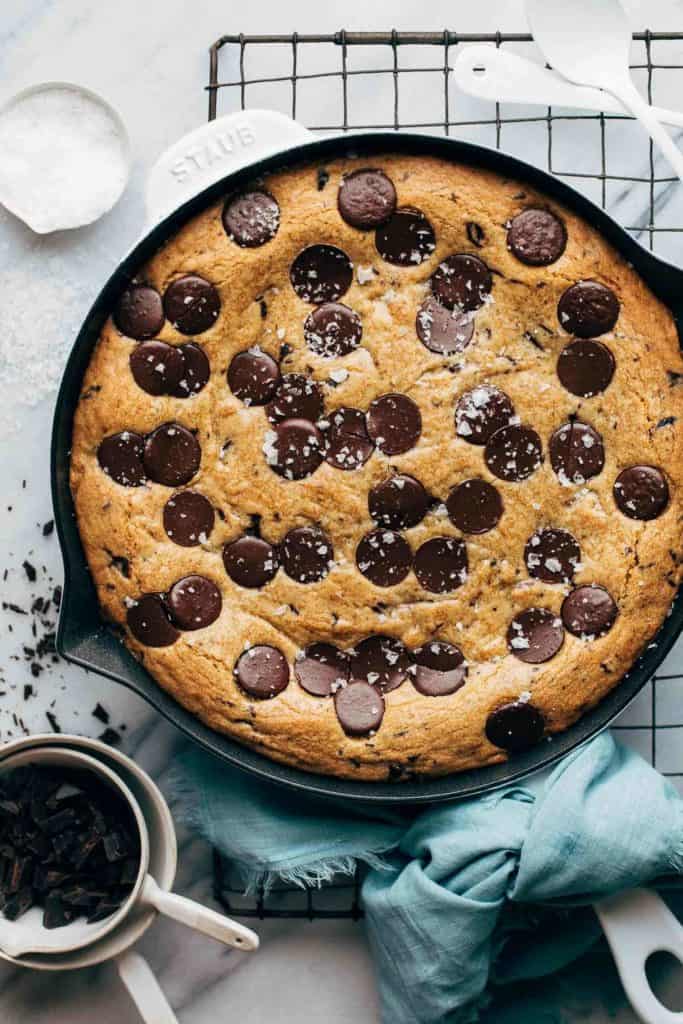 the top of a freshly baked skillet chocolate chip cookie