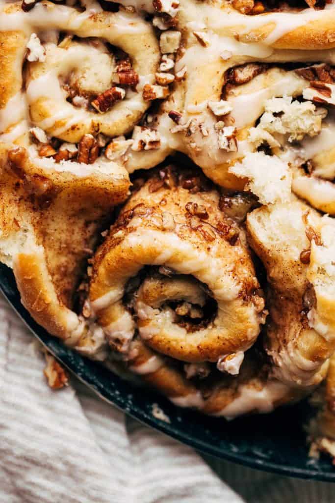 close up on the inside of a maple pecan cinnamon roll