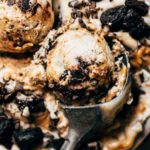 close up on a scoop of salted caramel brownie vegan ice cream