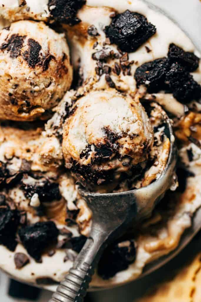 close up on a scoop of salted caramel brownie vegan ice cream
