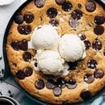 scoops of ice cream on top of a skillet cookie