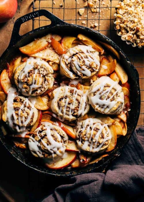 iced cinnamon roll biscuits on apple cobbler