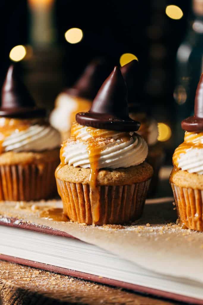 close up on a butterbeer cupcake topped with a sorting hat
