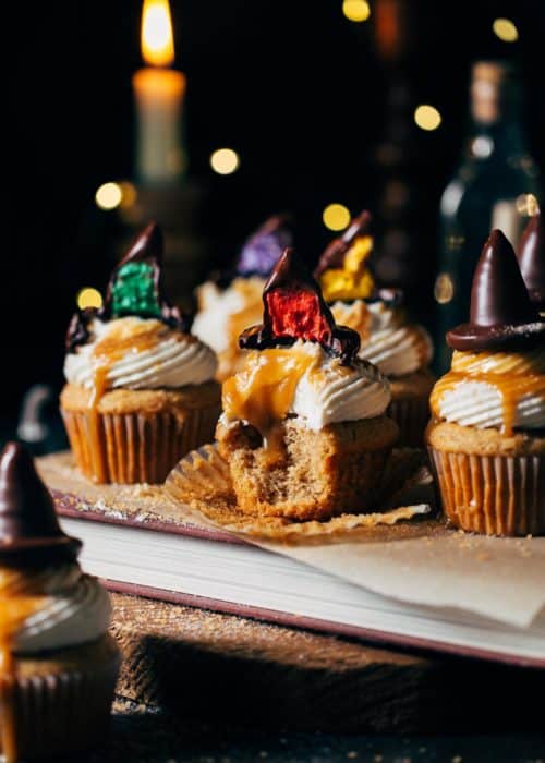 butterbeer cupcakes with buttercream filled sorting hats on top